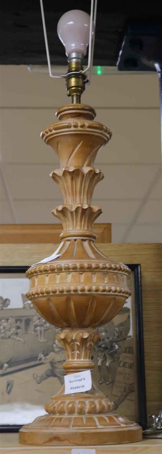 A carved pine table lamp